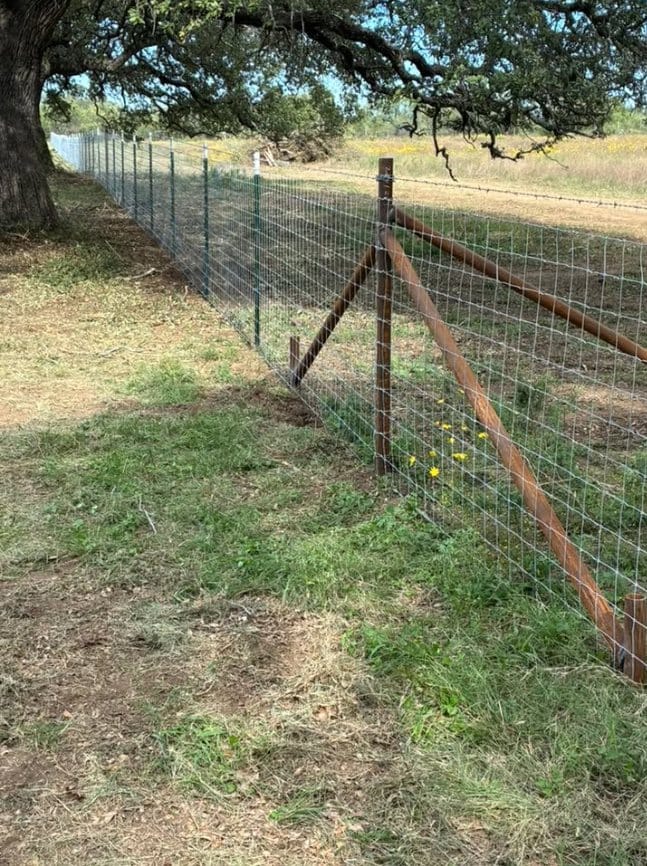 Pipe corner brace with new wire fence