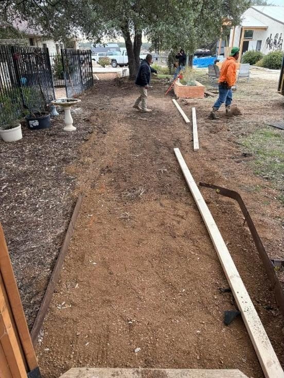 Crew setting forms for a walkway
